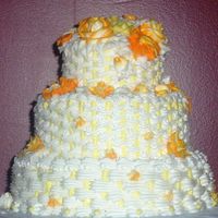 Yellow Flowers Shades of Yellow and Orange flowers with basketweave. 3 Tier Red Velvet with buttercream filling.