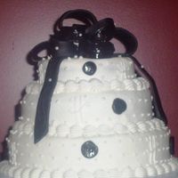 Black And White With Bow 3 tier red velvet with cream cheese filling. Black MMF bow and dots.