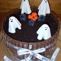 Graveyard Candy Cake This is a dark chocolate cake with a peanutbutter filling. I put kit-kats all around the edge as the fence and the decorations are all...