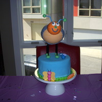What's A Garden Party With No Bugs? Cake made for my friend's little girl's 1st birthday. The party had a garden theme. Bee on top is made of chocolate. Cake is...