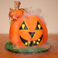 Smokin Carved Pumpkin Fondant Smokin' Carved Pumpkin Cake complete with dry ice to make it really look like a Jack o'lantern lit up and smokin.