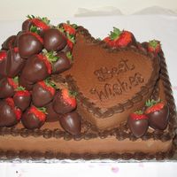 Matt 9x13 chocolate cake with 2 - 6" heart cakes on top. Frosted with chocolate buttercream and decorated with dark chocolate buttercream....