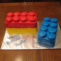 Lego Cake For the double stack of legos I took a 10" square cake and cut it in half and stacked one on half on top of the other. The blue lego...