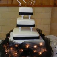 Amy's Wedding Cake My first wedding cake! And...it was purchased, too! She wanted a really simple cake and found a picture on-line that she wanted me to...