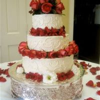 Roses! This was a red velvet cake with cream cheese frosting (chopped walnuts between the layers!) and decorated with scrollwork, roses, and...