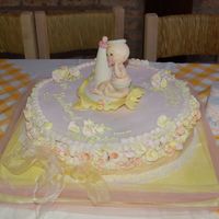 The Baby Was Modelated In Cold Porcelain All The Little Roses Around The Cake Are Made In Gum Paste The baby was modelated in cold porcelain. All the little roses around the cake are made in gum paste.