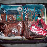 Terror Tale A Book cake, painted by hand and with some details in gum paste and sugar