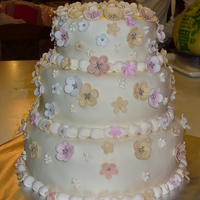 Flowers I made this cake for a baptism, it is vanilla cake with chocolate ganache & raspberry filling.