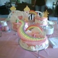 Care Bear Heaven care bear baby shower cake. the care bears came out of a quarter machine. clouds rainbow sun and castle were all color flow cream cheese...