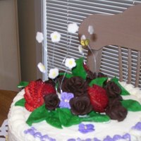 Strawberry And Chocolate Roses Chocolate cake iced with white chocolate cream cheese icing decorated with fondant bee and flowers and strawberies. Thanks to all at CC for...