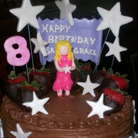 Pop Star My granddaughter requested a cake with chocolate covered strawberries and chocolate frosting. I made a white cake, with strawberry filling...