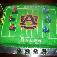 Auburn Football Cake Yellow sheet cake frosted with crusting buttercream icing.