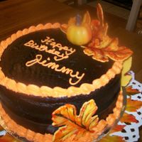 Fall Birthday Cake Killer Chocolate Cake (CC recipe) frosted with Walter's Crusting Chocolate Fudge Icing (CC recipe). The leaves are yellow fondant and...