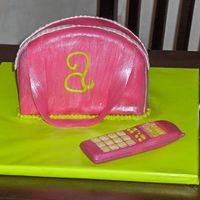 Pink Purse strawberry cake, cream cheese frosting covered in fondant. i want to say thank you to sillyoldpoohbear for her help . the shape is taken...
