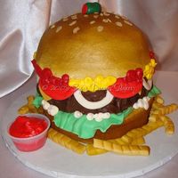 Cheeseburger!!! Here's the cake I made for our 4th of July Party today! I'm pretty proud of it considering that it was the first one I made like...
