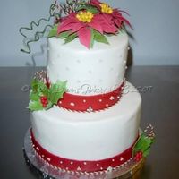 Poinsettia Holiday Cake Cake that I made for my mom's holiday party at her work today. It's a WASC cake with Sugarshack's Buttercream as filling/...