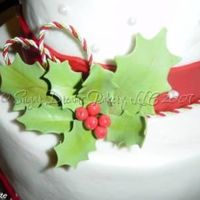 Holly & Berries These are one of the bunches of gumpaste holly that I made for a holiday party cake. They were so easy and simple to make...wish all leaves...