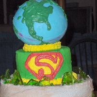 Superman strawberry cake with cream cheese icing (recipe courtesy of denise2434). the best icing i have ever had!!!! 10 inch round with 6 inch round...