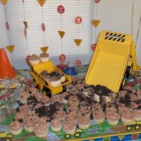 Construction Cupcakes CUPCAKES MADE TO LOOK LIKE DIRT DUMPED FROM THE DUMP TRUCKS. CHOCOLATE BC AND WHITE XCAKE WITH FRENCH VANILLA PUDDING ADDED TO THE MIX