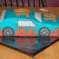 Ethans Race Car Basic butter cake with crusting cream cheese icing. first carved cake ever!!!! was very nervous next time i wont be so scared to carve the...