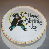 Harry Potter Birthday Cake 10" chocolate cake filled and iced with buttercream. The image is a FBCT.