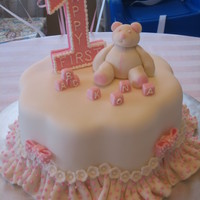 Frilly First Birthday This was for my daughter's first birthday. Everything is fondant or royal icing. The blocks spell her name "Kona".