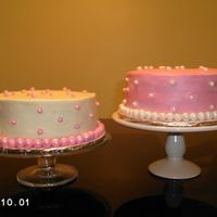 Pretty In Pink Pink cake is carrot cake w/ cream cheese flavored bc, fondant pearlsWhite cake is a white cake w/ raspberry filling and white choc bc icing...