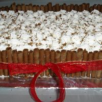 Chocolate Pirouline Cake This is the second made for a church banquet. It's a choc fudge cake, bc icing and choc cream cookies.