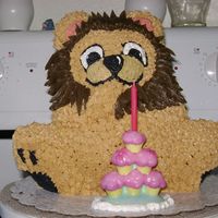 Leo The Lion Made with Wilton 3D Bear Pan, Used two boxes of milk chocolate cake batter and icing is vanilla colored to the colours needed. Took 4.5...