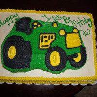 John Deere Trator Cake For A First Birthday butter recipe cake with bc icing. sheet cake with tractor cake on top