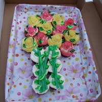 Flowers made with fruit slices & twistlers. red velvet cupcakes with cream cheese icing