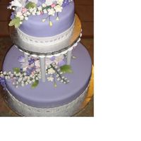 Lily Of The Valley And Violets For Diane Gumpaste lily of the valley, violets and fantasy flowers are the main flowers on this lilac fondant covered wedding cake.