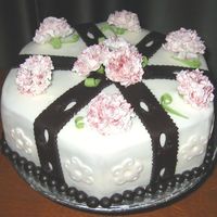Carnations Wilton Fondant & Gumpaste. Last cake completed in class. Black fondant trim and burgandy tinted gumpaste carnations