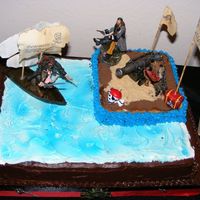 Pirates Yellow rum cake with buttercream icing. Figures from Pirates of the Caribbean.