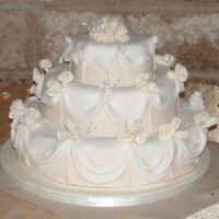 Tito's And Vanessa's Wedding Cake Yellow cake with amaretto flavor covered in fondant.