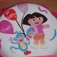 Dora The Explorer yellow cake with heath bar covered in fondant. figures are made from fondant.