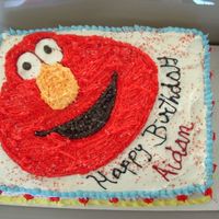 Elmo Birthday Cake White cake with strawberry filling. Buttercream frosting. Buttercream Elmo.