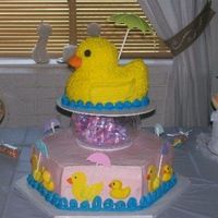 It's Raining Baby Ducks!!! Made this cake for my daughter's baby shower. Ducks are fondant/buttercream, icing is buttercream on big duck and cake.