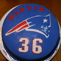 Bday Cake For Patriots Fan Red velvet cake with IMBC cream cheese frosting covered in fondant. All accents in fondant