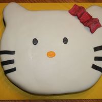 Hello Kitty Birthday Hello kitty cut from 1/2 sheet cake. Used corners of cake to make ears, just put a skewer through them and glued them on with buttercream....