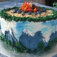 Campfire/mountain This was a birthday cake. It's all BC. The logs were cookies. I inserted a few color-flamed candles in the center of the fire and when...
