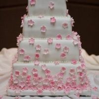Pink Blossom Fondant covered cake with gumpaste blossoms.