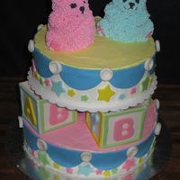 Baby Shower Cake This cake was done for a little boy and girl. The blocks, stars, and buttons are all gumpaste, the rest is all buttercream! The mom's...