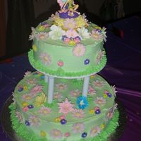 Tinkerbell This cake I did for a special little girl who loves Tinkerbell. The cake is covered in buttercream and the flowers are gumpaste and royal...