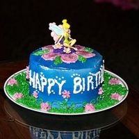 Tinkerbell Smash Cake This cake was made for my 1yr. old niece. It's carrot cake with cream cheese filling, decorated with buttercream.