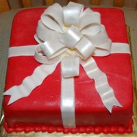 Red Present Red fondant over chocolate cake. Gumpaste bow.