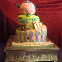 Alice In Wonderland Cake My 1st topsy turvy cake. Bottom is 3 layers of white velvet w/choc chips, middle layer is strawberry, and top is rice krispy treats.
