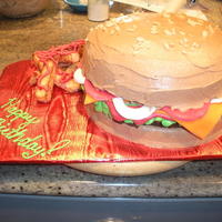 Hamburger And Fries buns are 8" round vanilla cakes. Hamburger patty is a brownie. fries are pieces of cake that were broiled on all sides. fixin's...