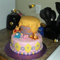 Whinnie The Pooh Cake figures are all fondant10" white velvet chocolate chip cake, 3 6" cakes carved to make hunny pot.