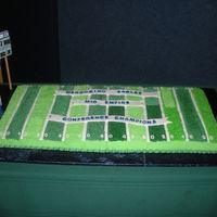 Football Field 6 9x13 cakes. 3 chocolate 3 vanilla. The board it is on is 2'x4' . scoreboard and goal posts are wood covered with mmf and royal...